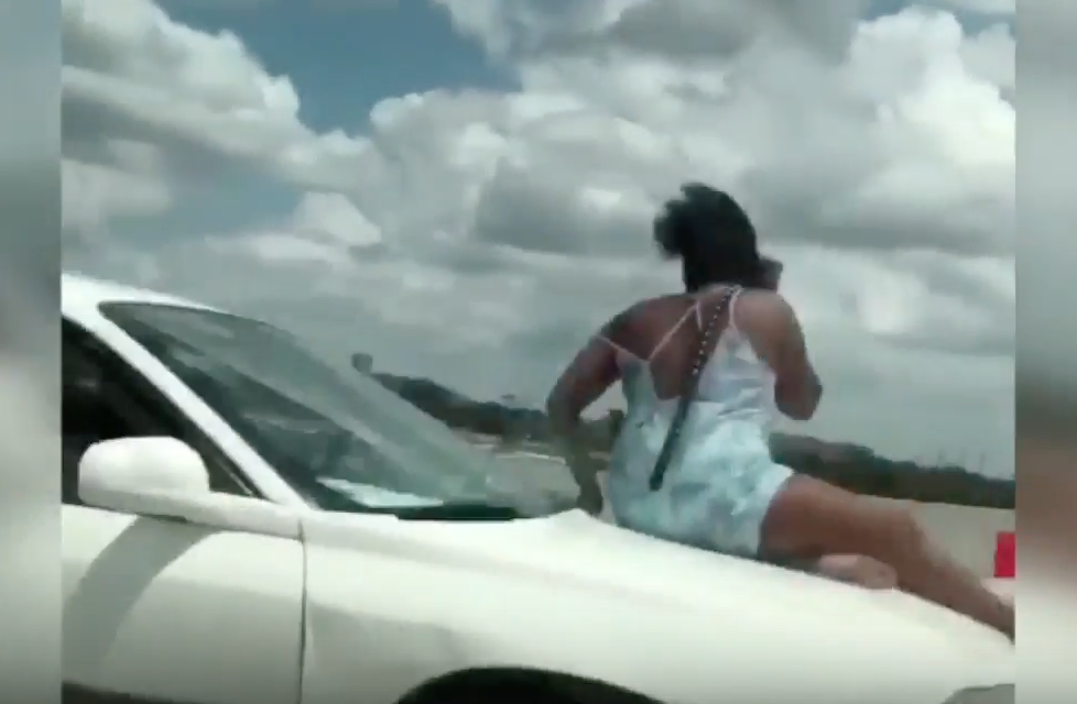 Woman Rides On Hood of Car on Highway 290 in Houston on Video